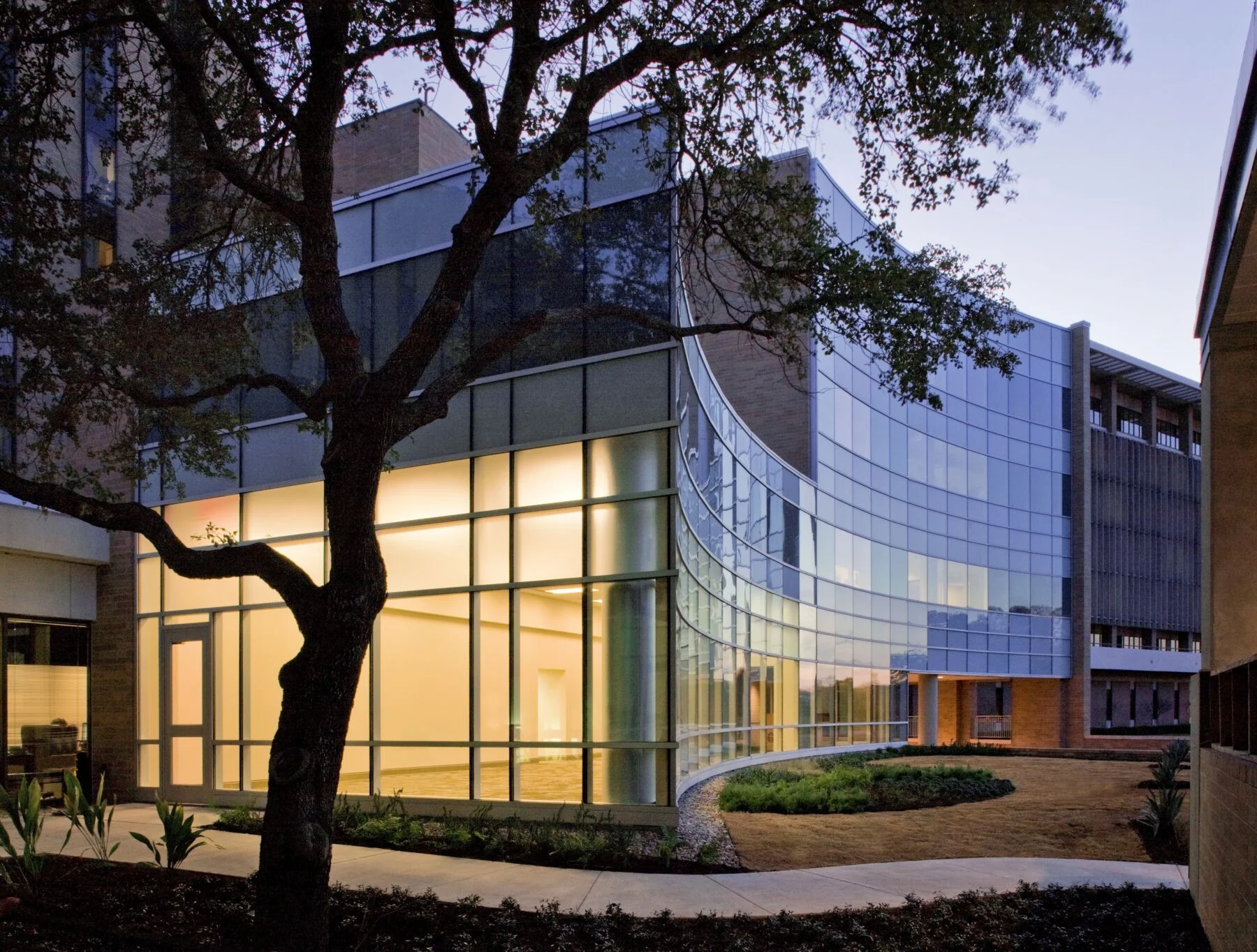 six story glass tower with tie ins to existing hospital