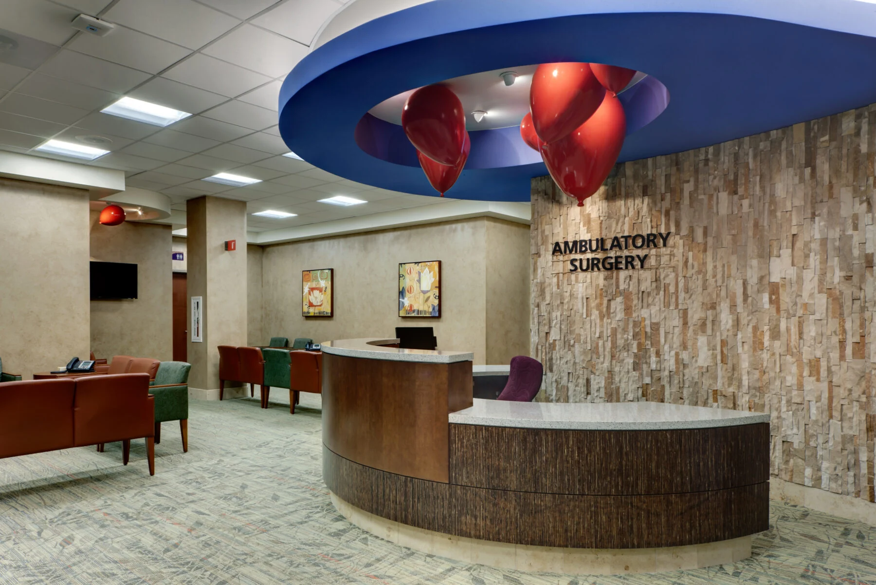 welcome desk with art from ceiling