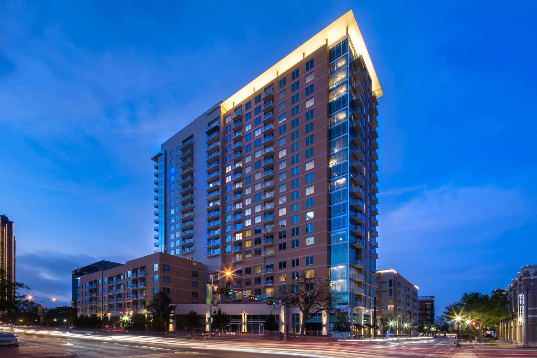 three buildings in mixed use space including 21 story residential tower and 2 five story buildings