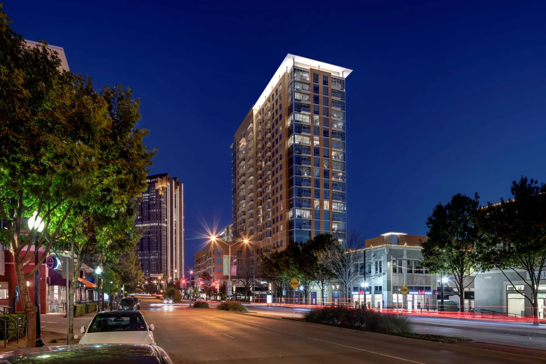 three buildings in mixed use space including 21 story residential tower and 2 five story buildings