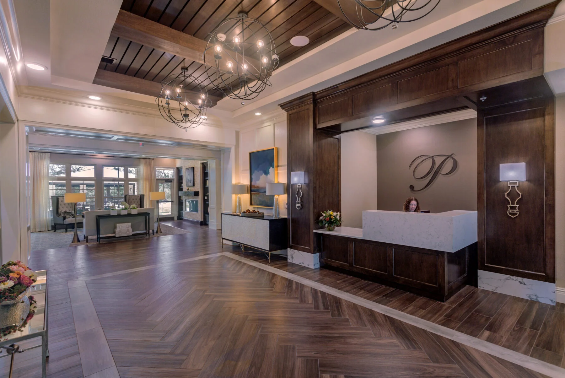 lobby entrance with custom wood desk and floors