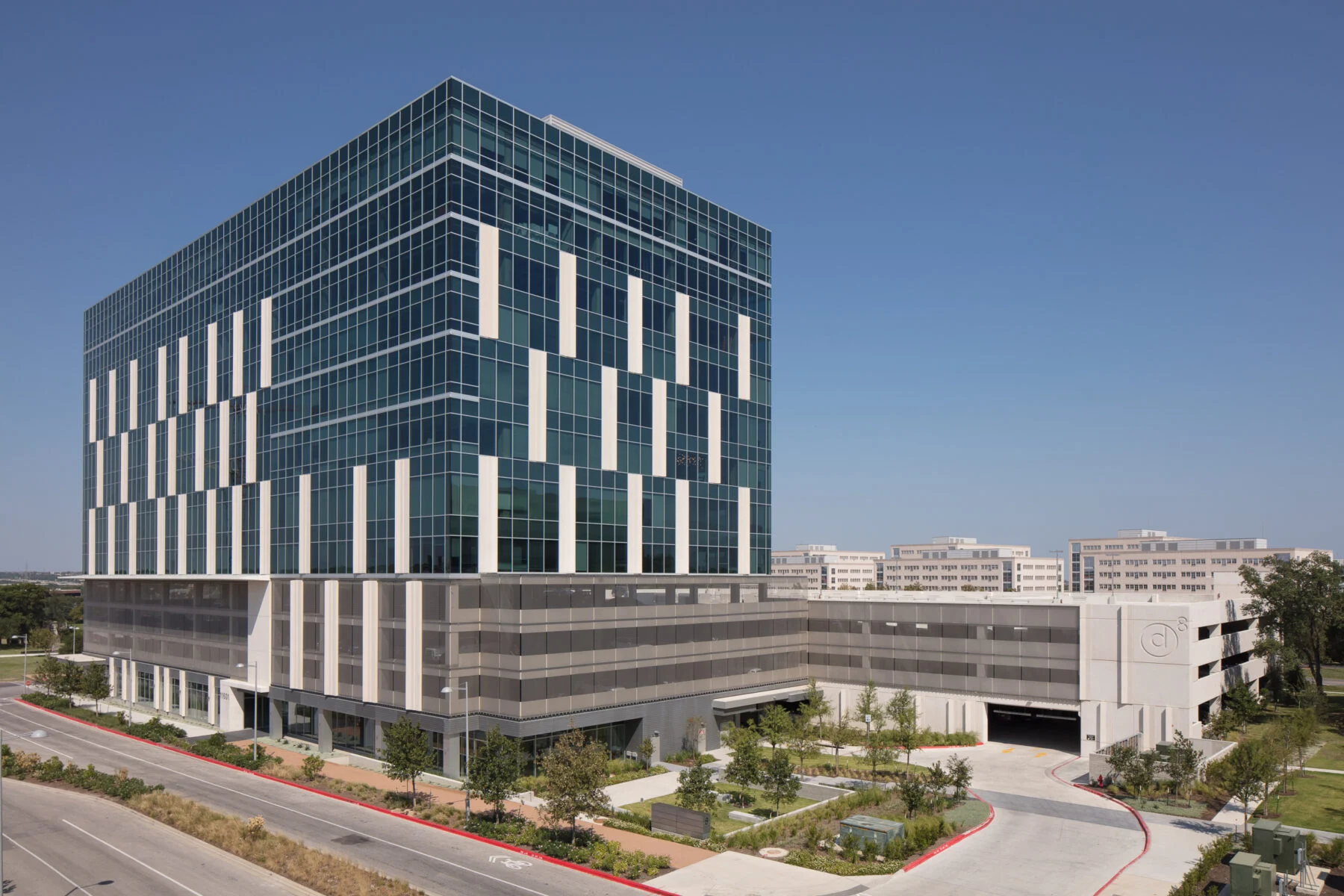 twelve story office building with four story parking garage