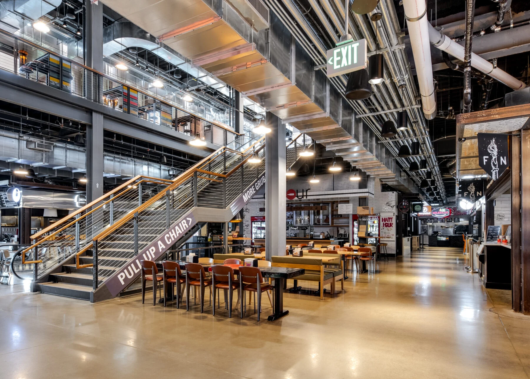 Interior dining corridor at Legacy West in Plano, Texas, lined with restaurant storefronts.