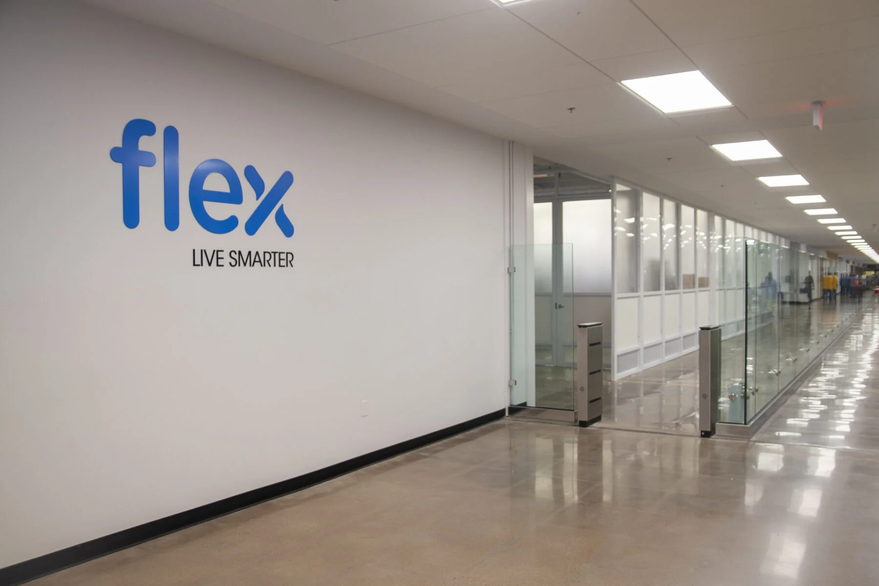 lobby space for Flex with white walls and blue signage