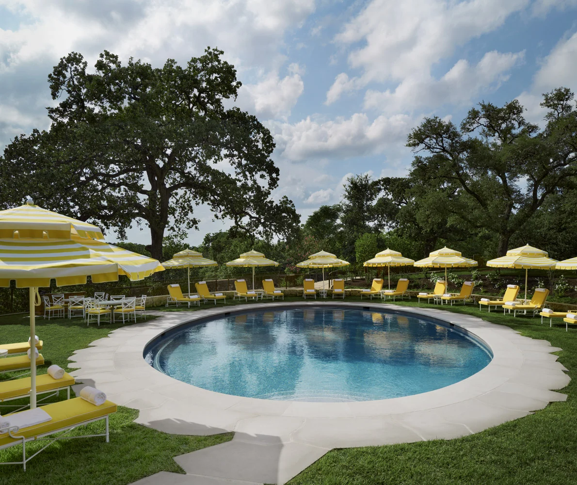 Circle pool with yellow umbrellas