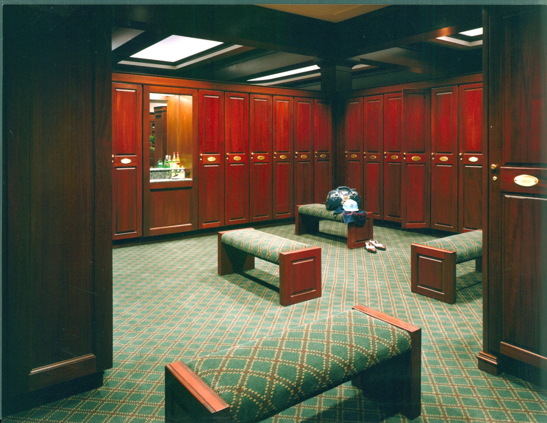 Custom cherry wood lockers in men and women's locker rooms.