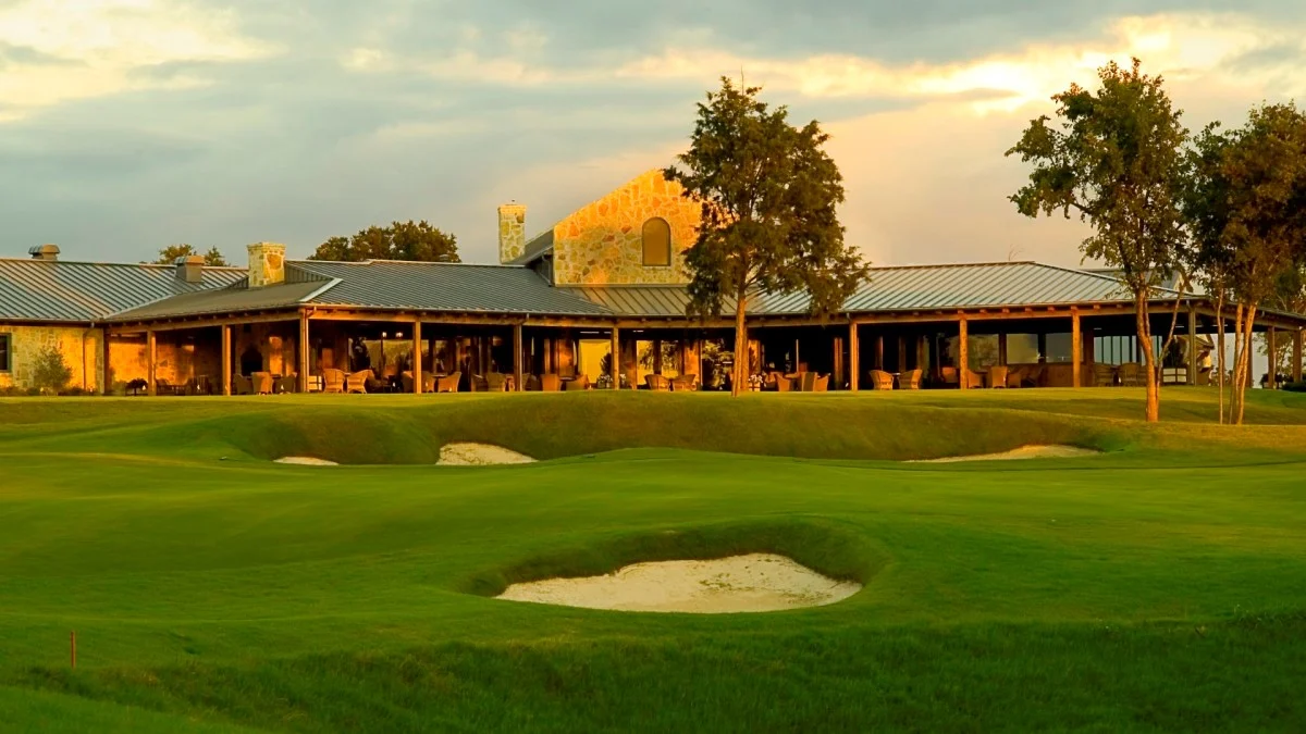 Chipping and putting green in front of Dallas National Golf Glub entrance.