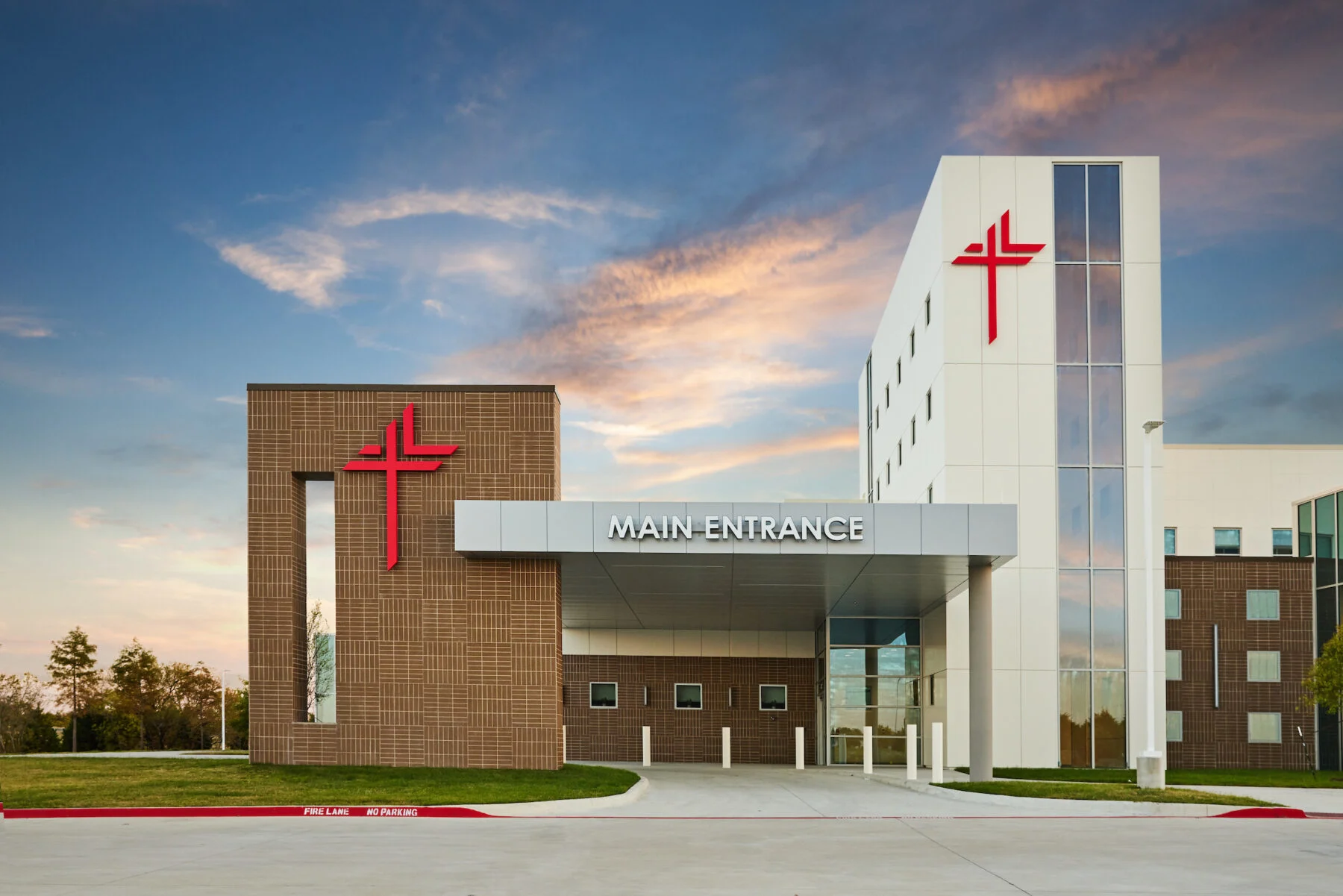 front entrance to two story regional hospital with custom exterior signage