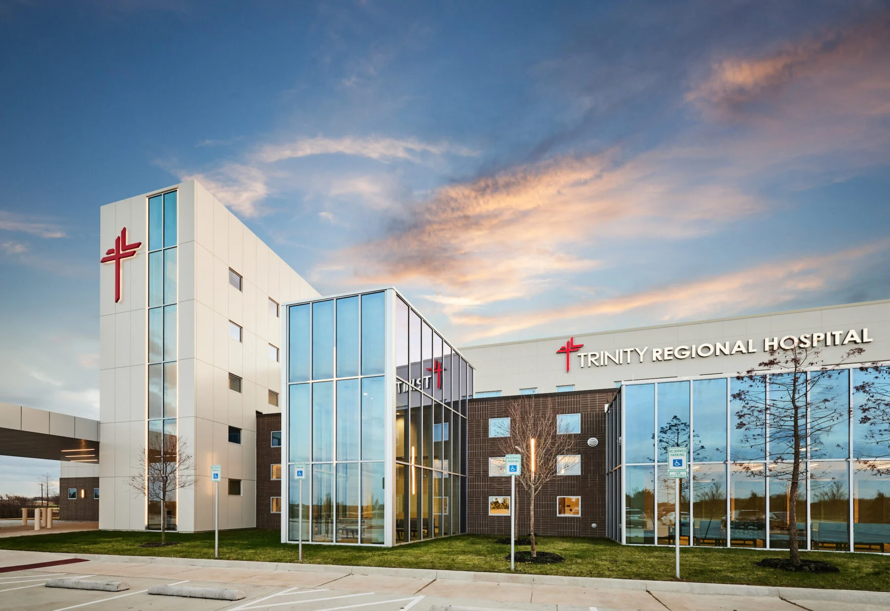 side entrance with glass to two story regional hospital with custom exterior signage