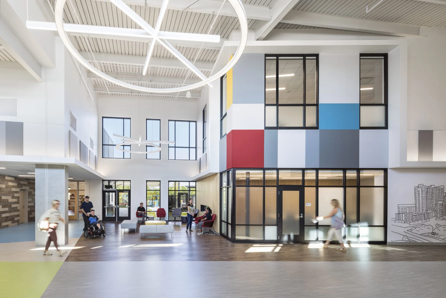 accessible lobby with colorful walls and custom lighting