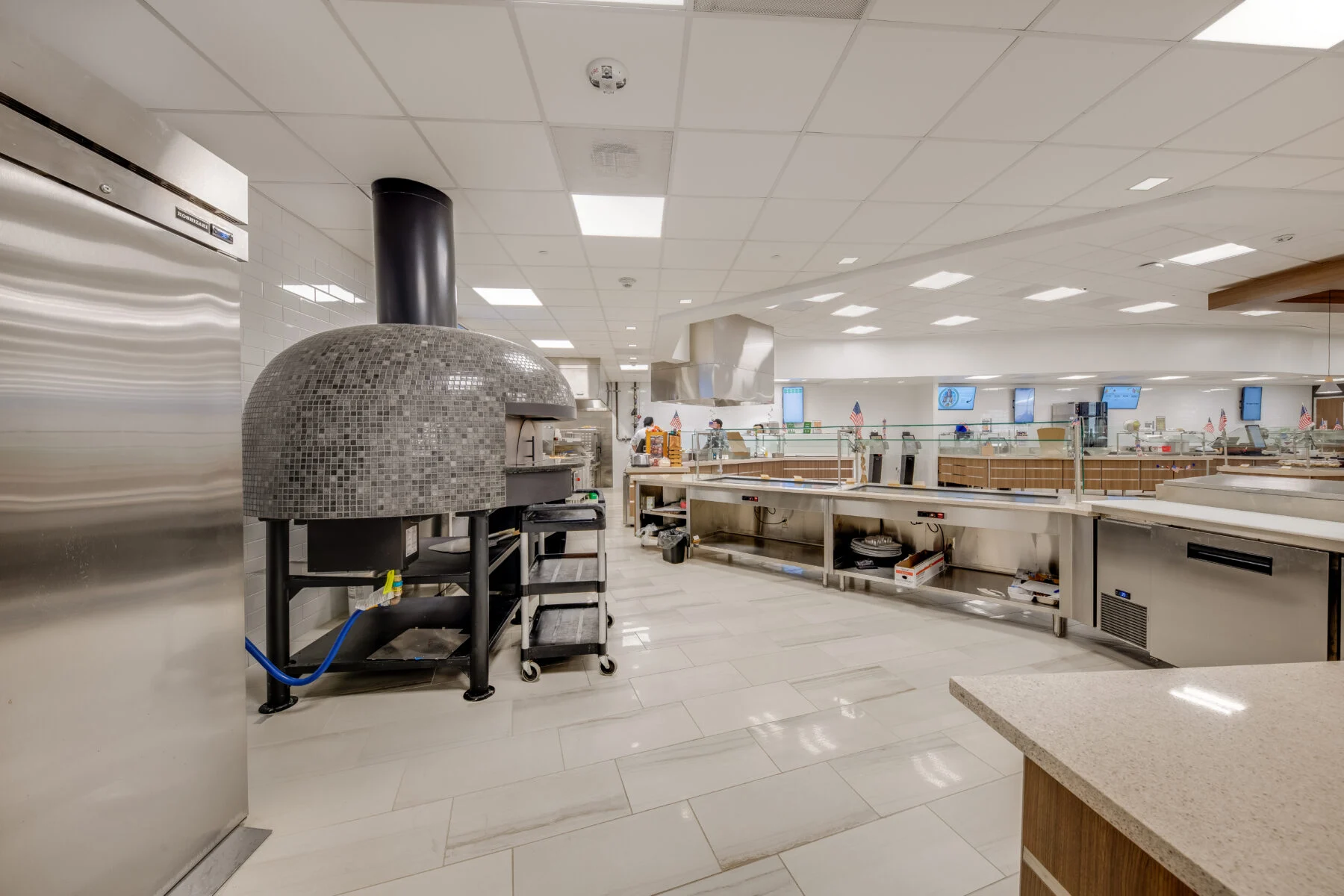 commercial kitchen with pizza oven