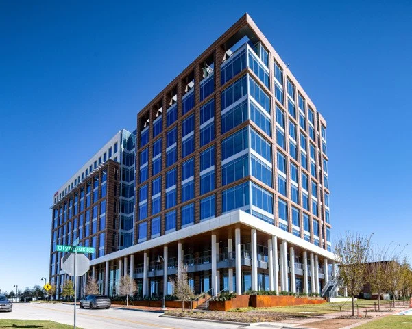exterior of ten story precast panel skin and glass office building