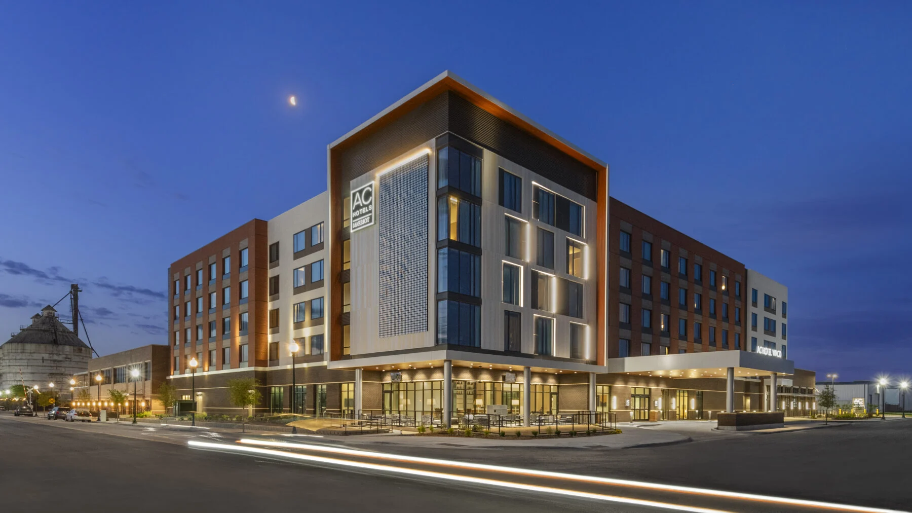 Exterior of AC Marriott Hotel in Waco with the Magnolia Silos in the background.