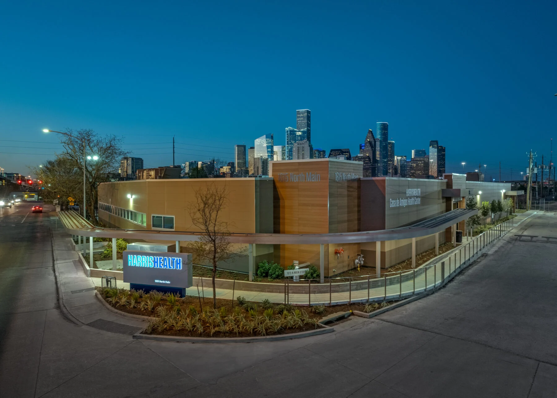 exterior of curved healthcare space with downtown houston in background