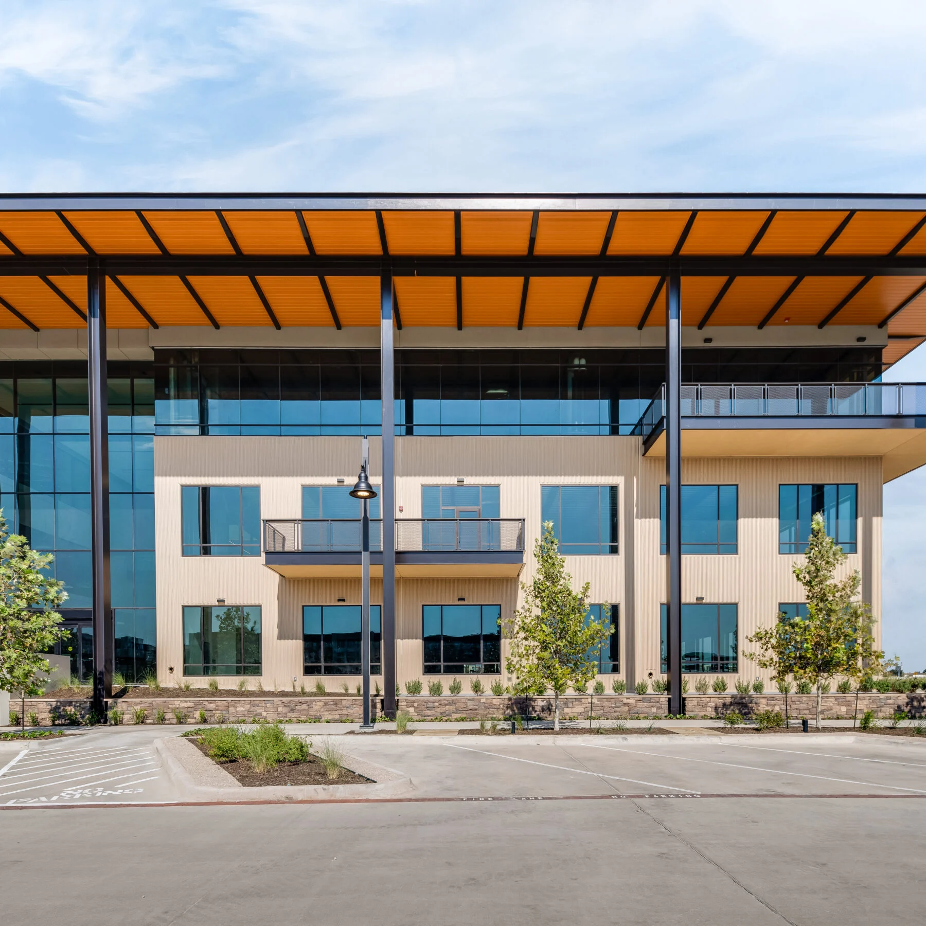 coworking space with three stories and top floor made of glass