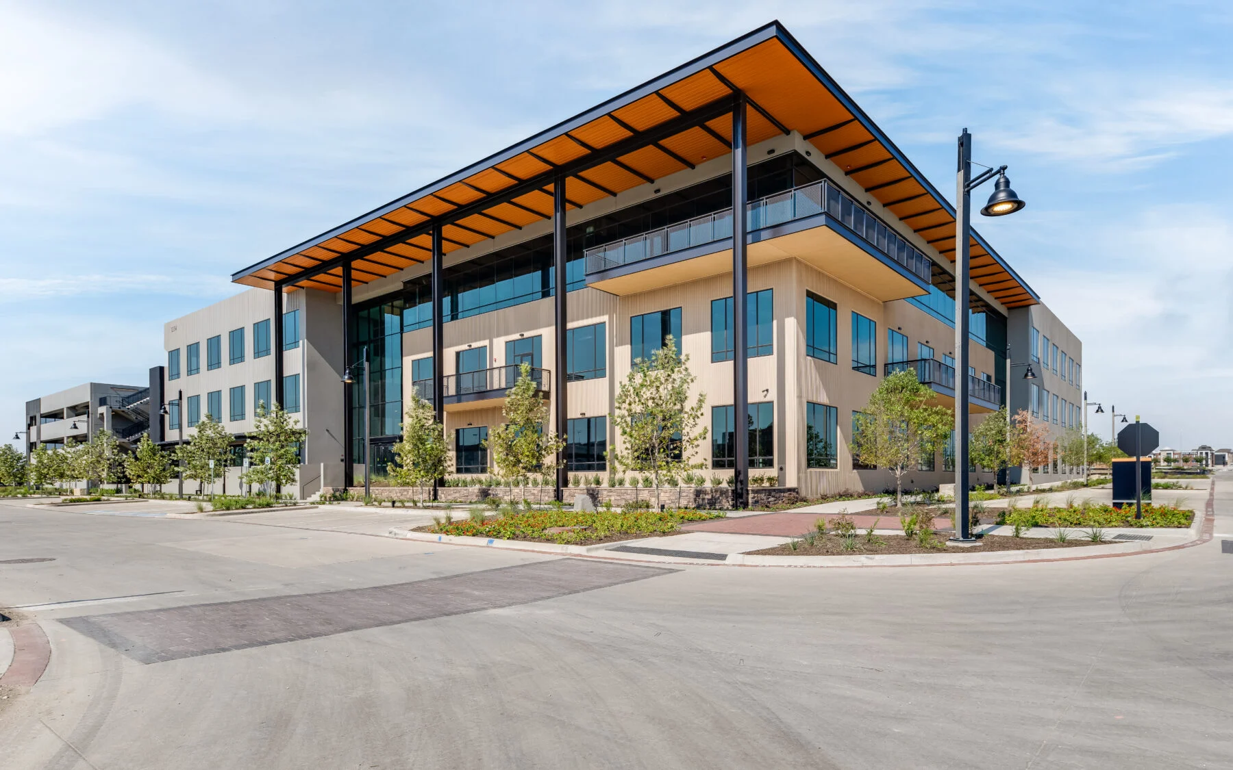 three story building with wood awning and windows
