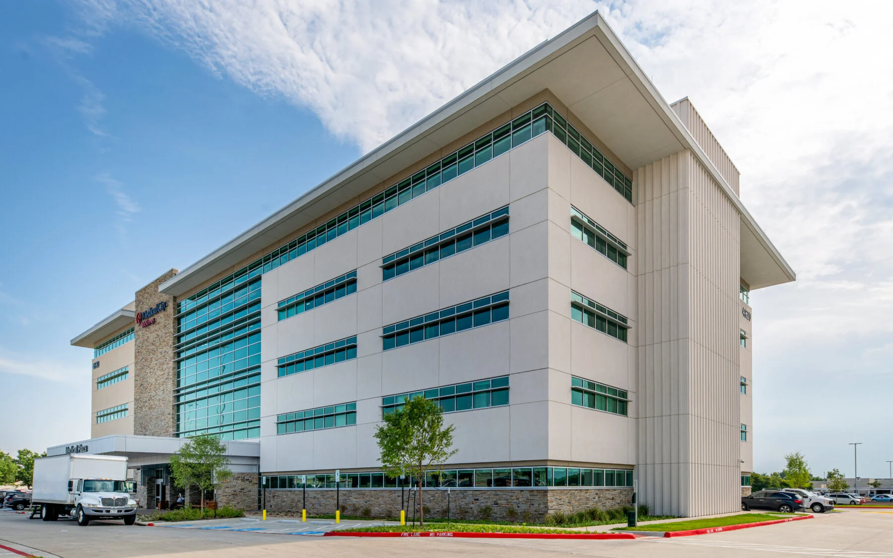 exterior four story medical office building with white stone