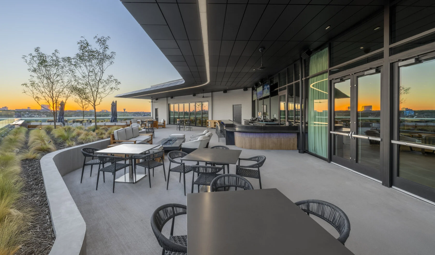 Patio space overlooking sunset at the COSM venue