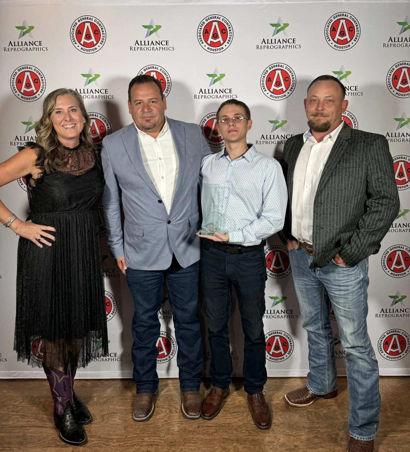Houston project pose with APEX award from AGC Houston