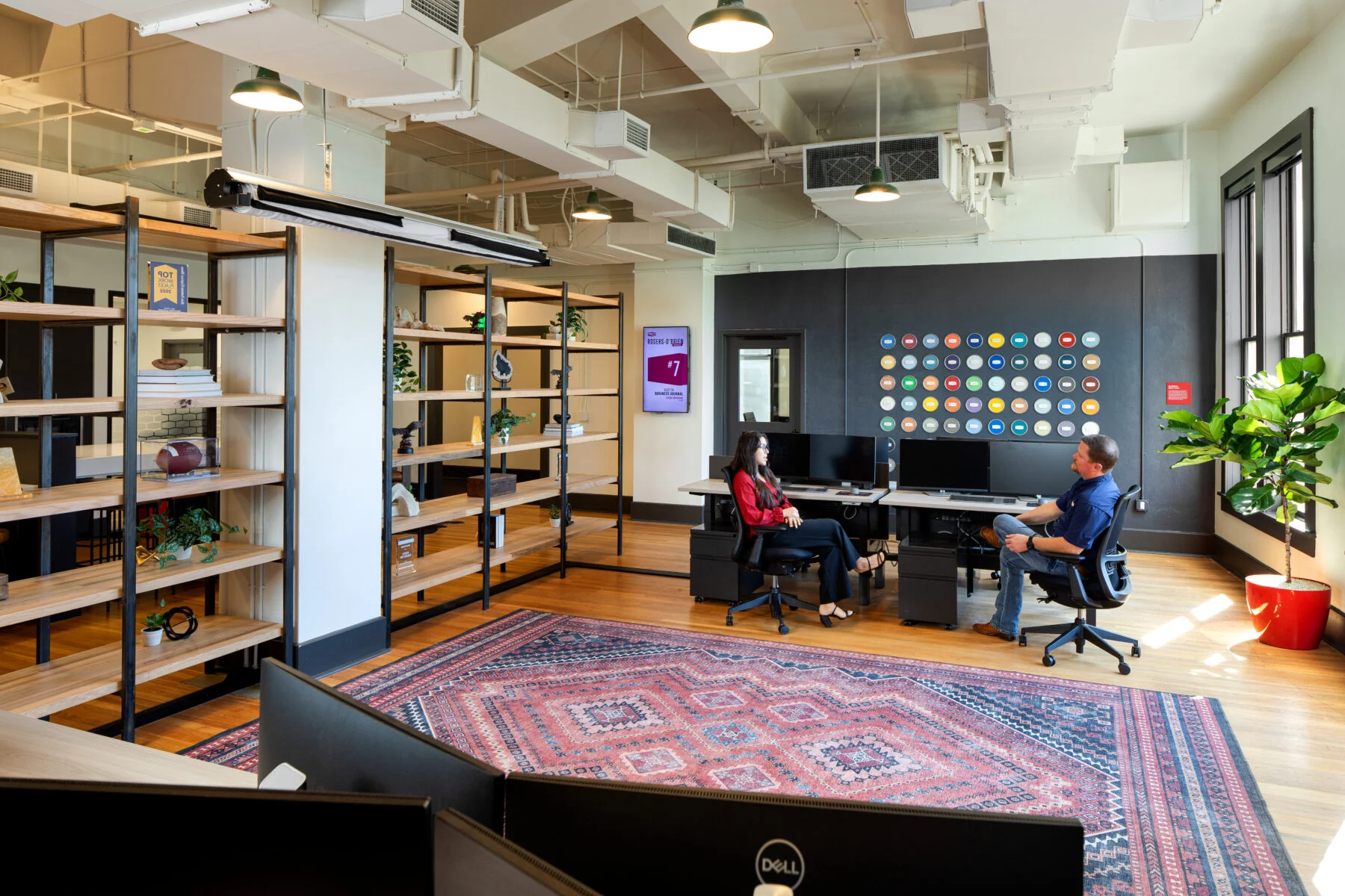 open working space with desks and wall art and custom millwork
