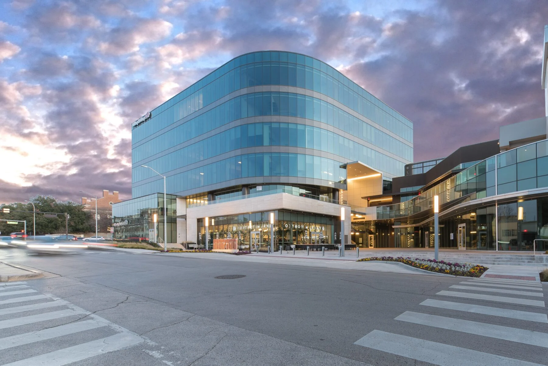 curved window building with retail space