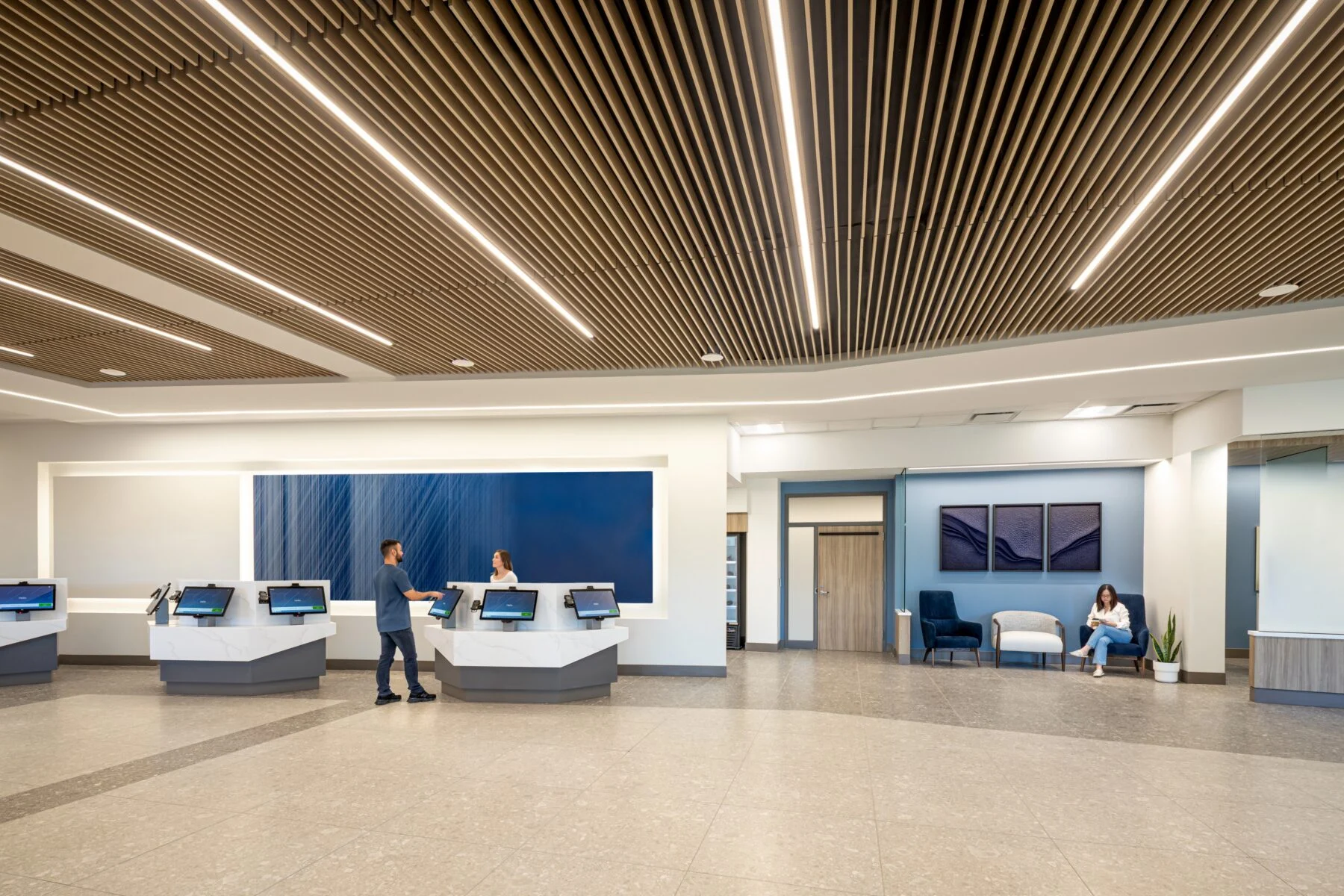 check in station with custom wood ceiling