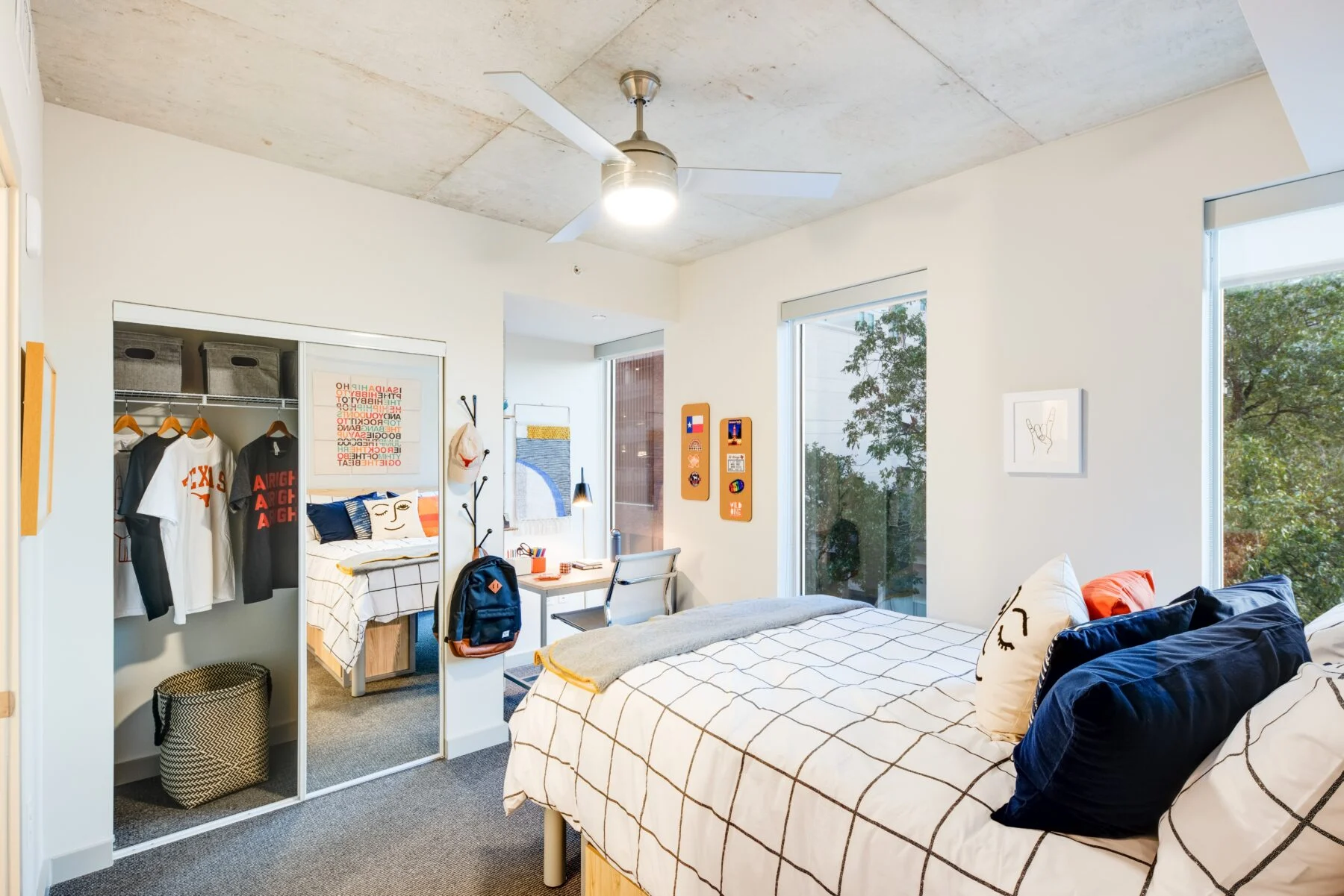 student bedroom with closet and study space