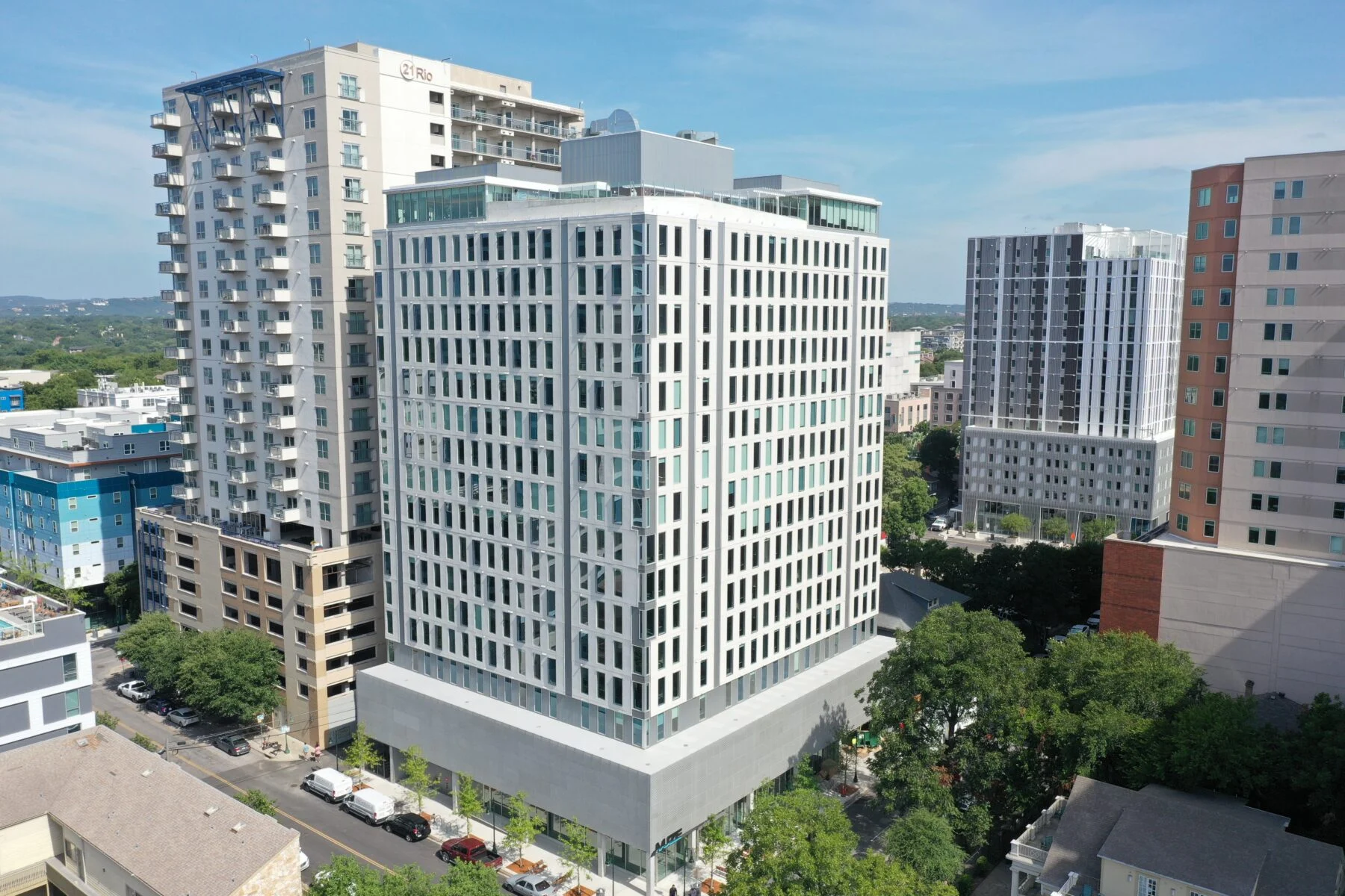 exterior 18 story apartment with parking garage in austin