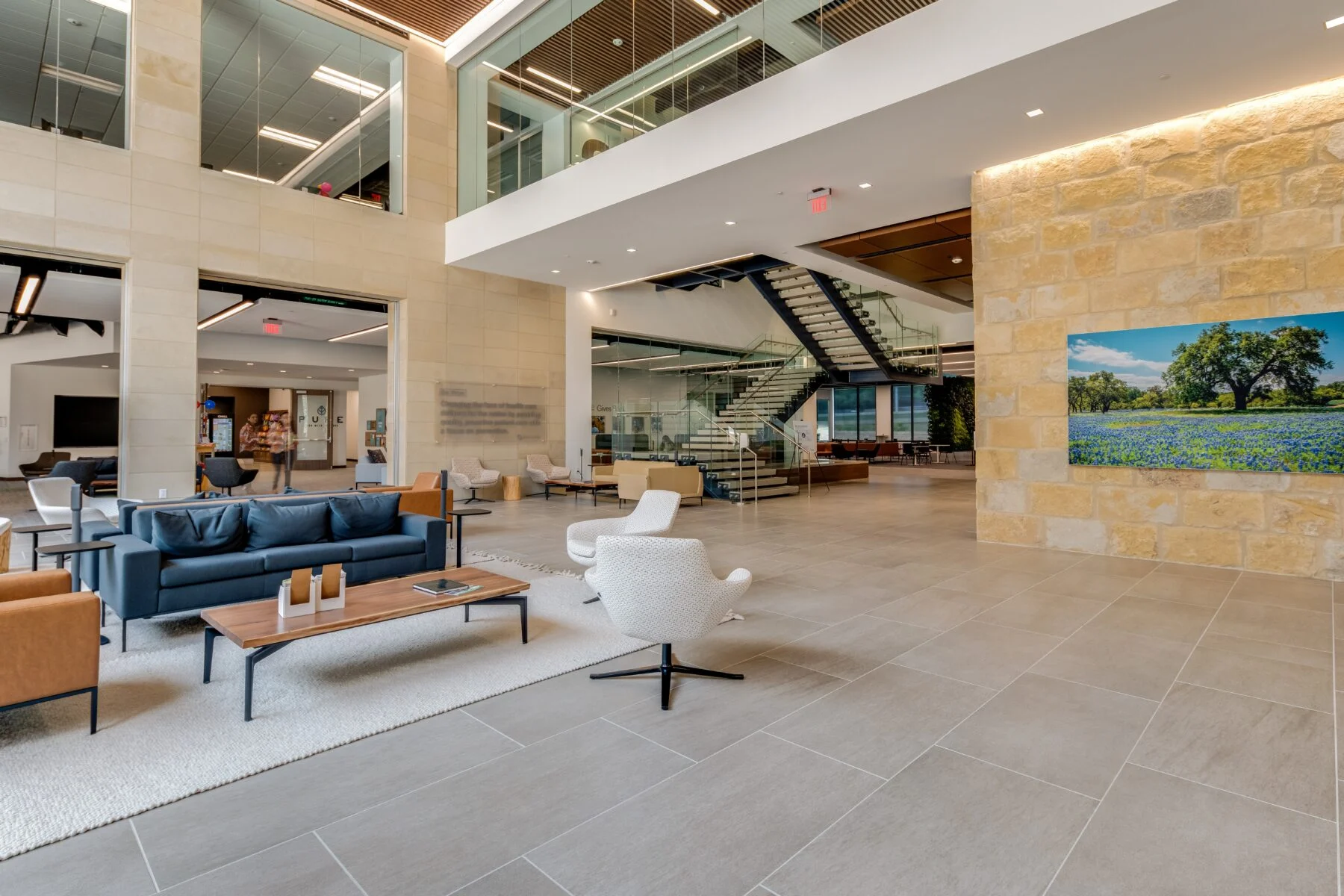 interior lobby with stone walls and exposed staircase