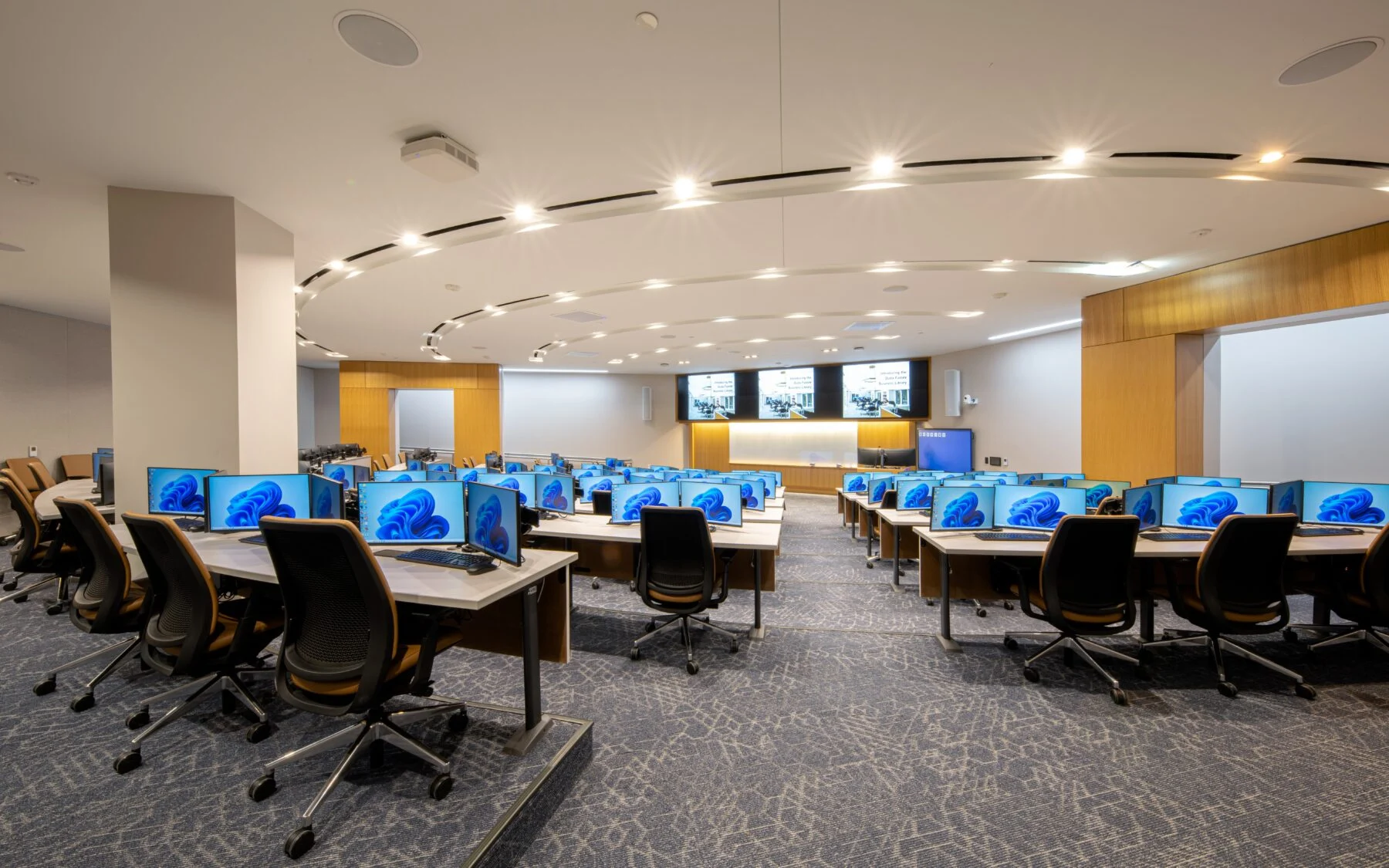 curved lecture hall with computers