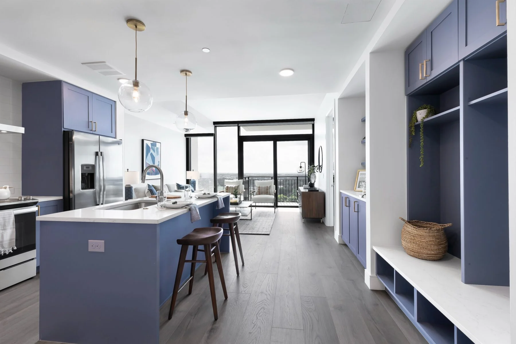 apartment with kitchen island and built in shelving