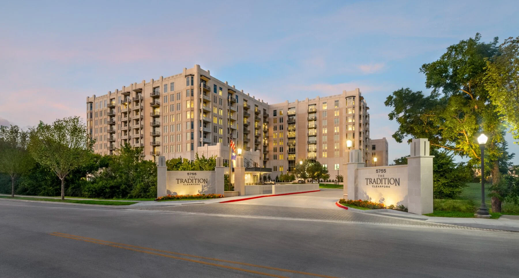 lit entrance to nine story senior living