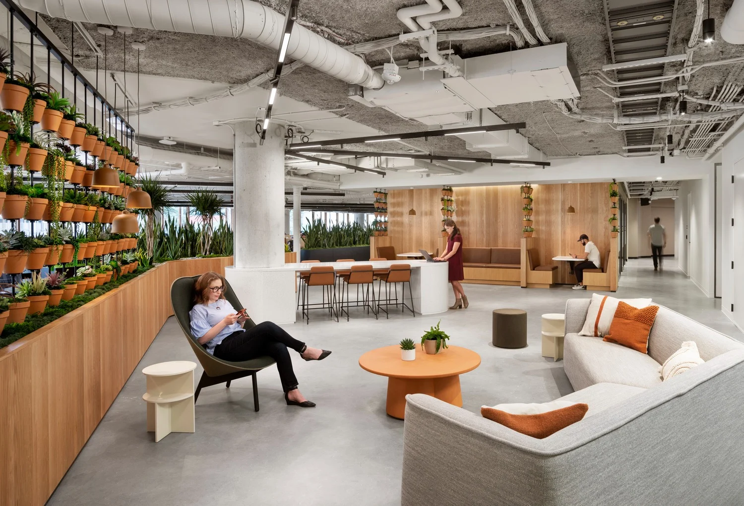 gather space with custom plant wall and co working cubicles