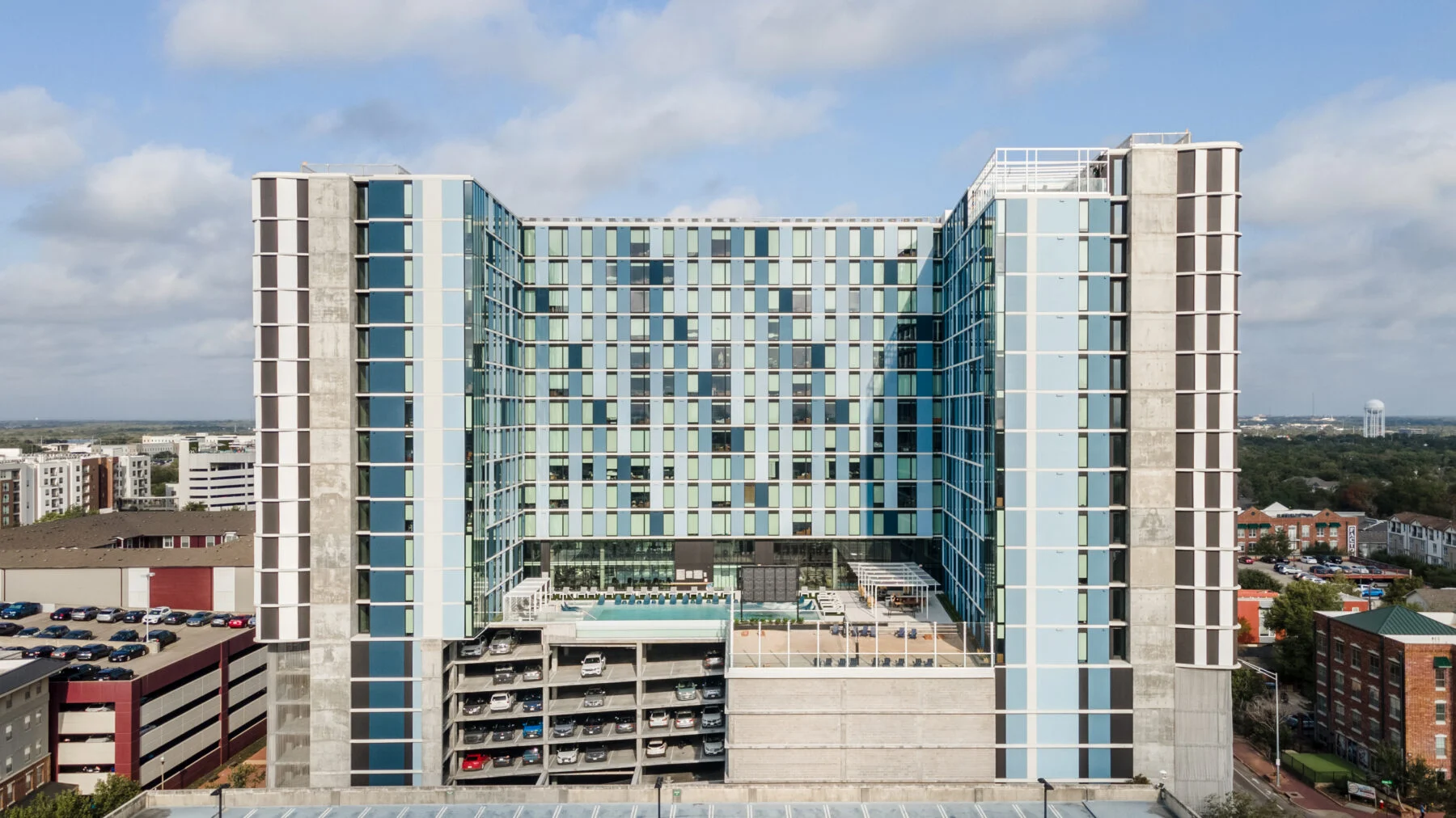 U-shaped 19 story high rise with parking garage