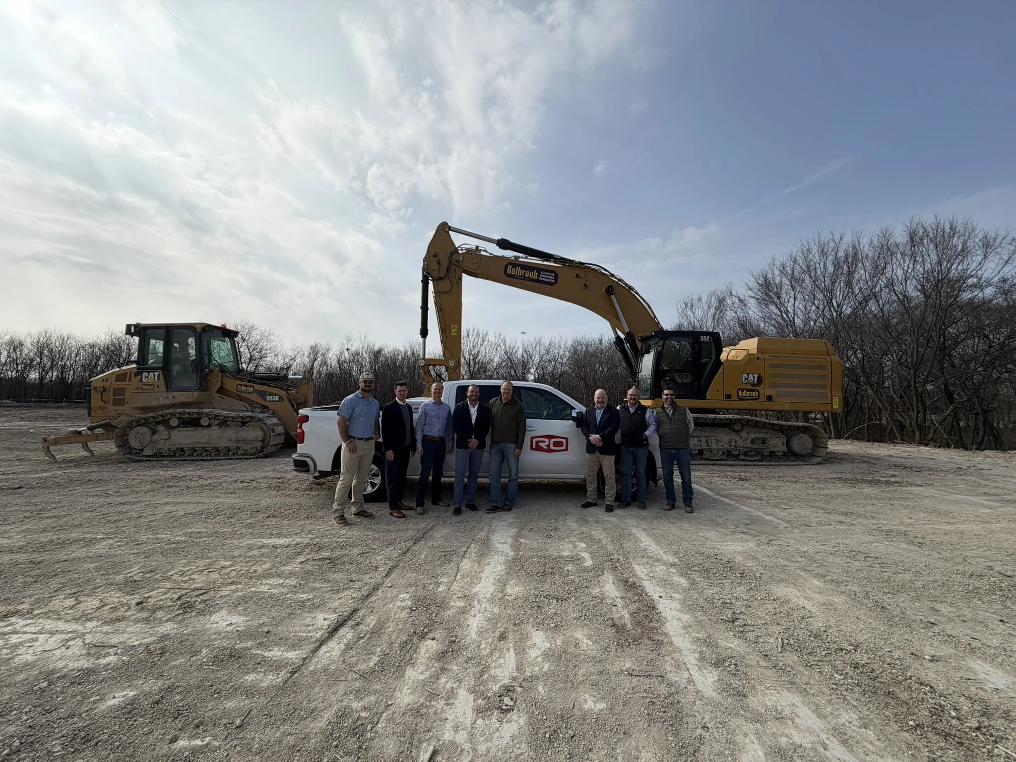 groundbreaking event with heavy machinery