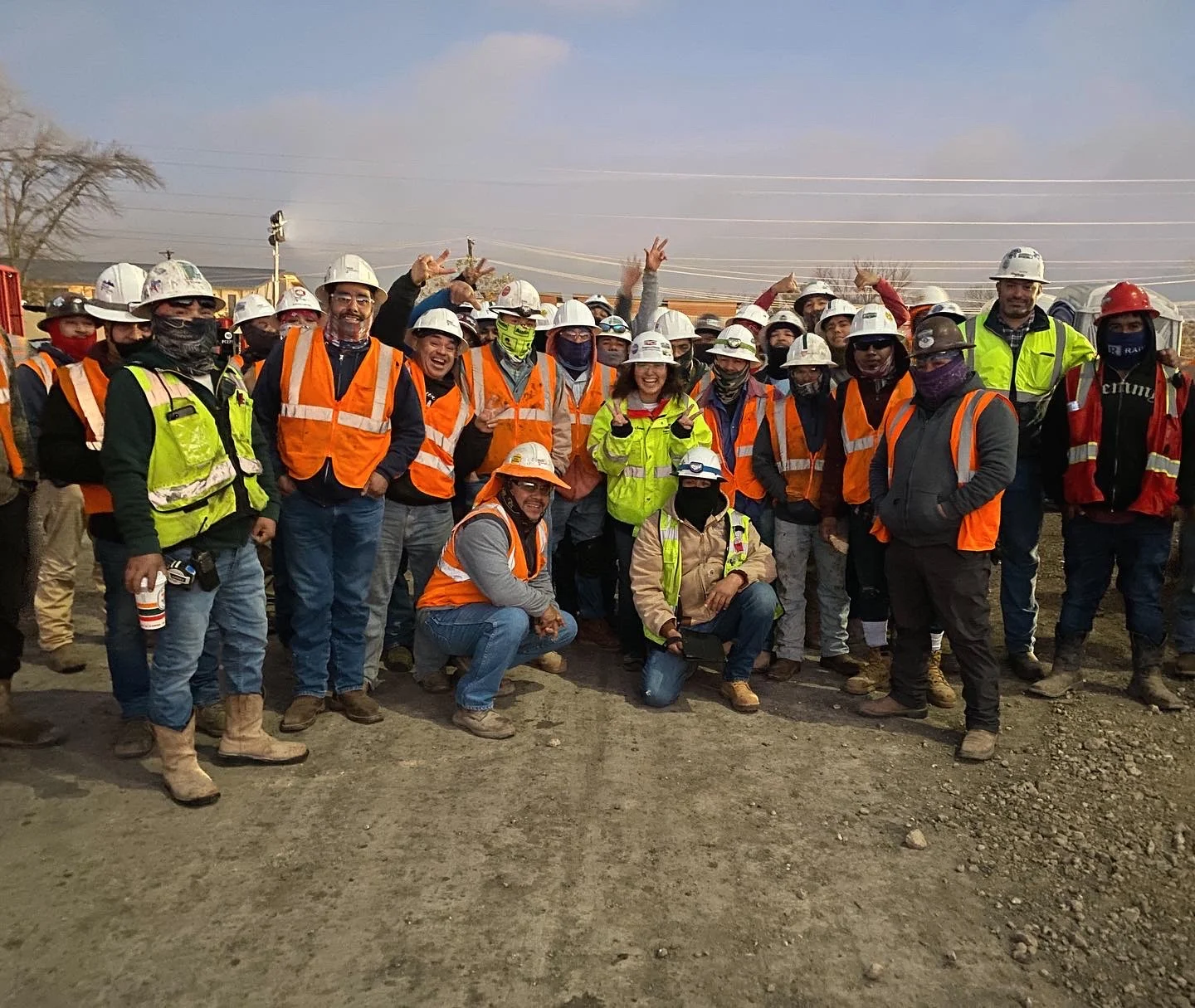 team photo with foreman and field workers