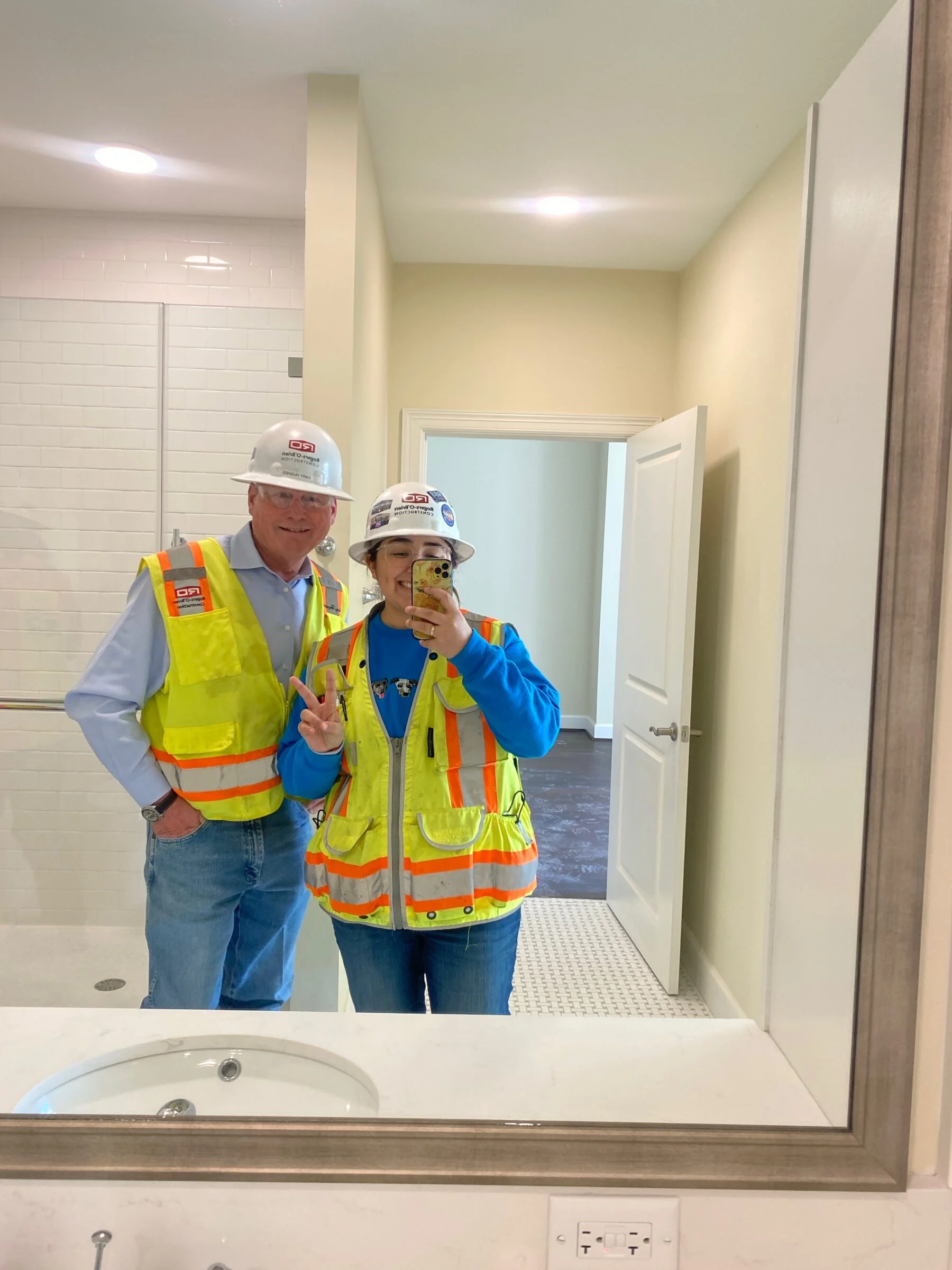 two people in construction PPE